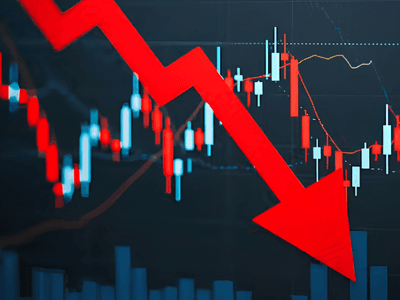 Stock market chart displaying a downward trend with a prominent red arrow
